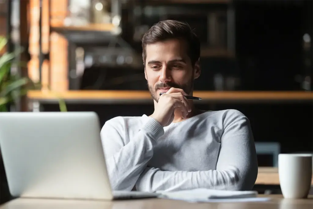 man at desk on laptop