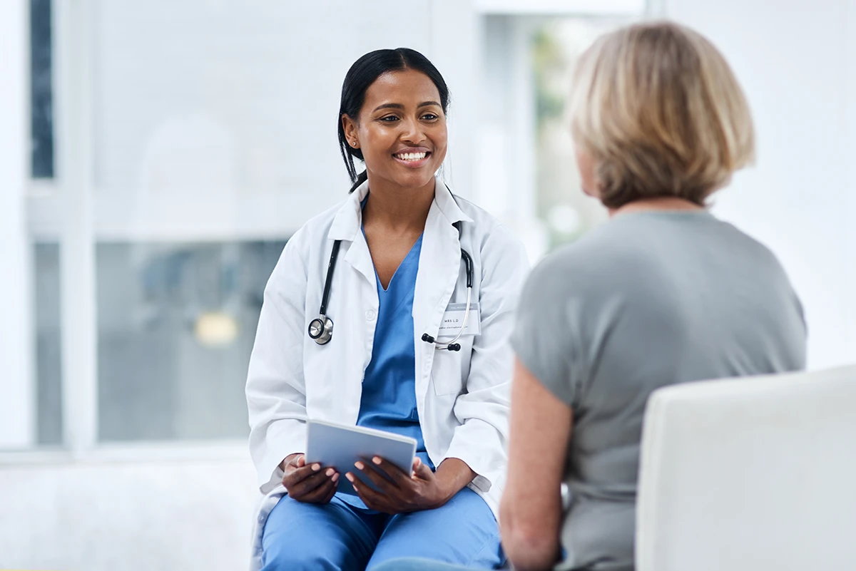 doctor smiling with older woman