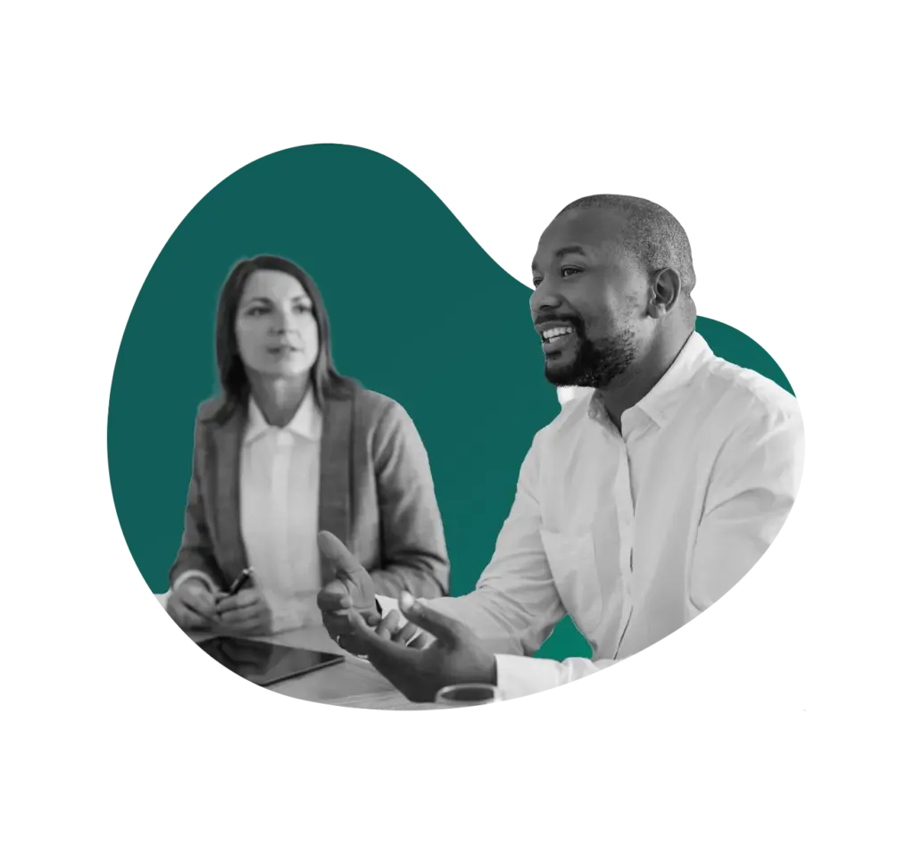 man and woman at desk talking