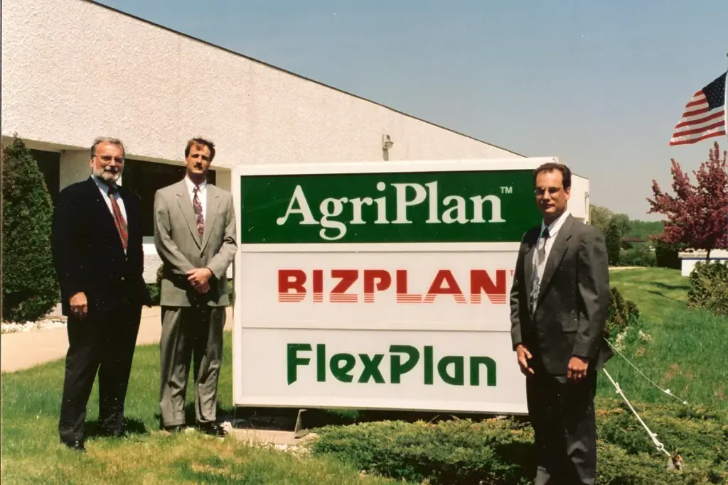 TASC Leadership standing next to the plan logos